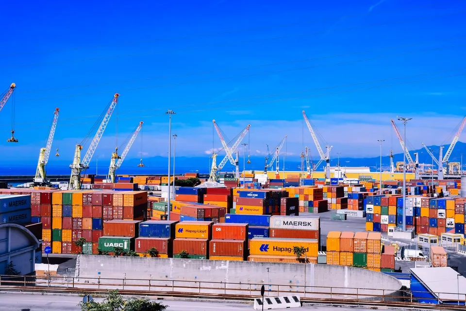 Shipping containers and cranes at a commercial port